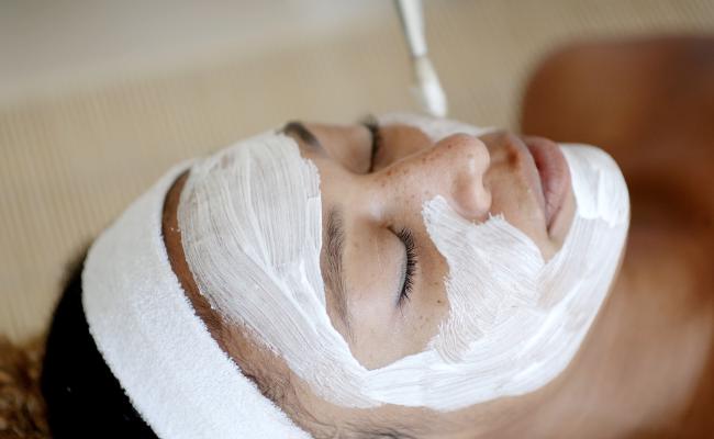 Woman enjoying a facial.